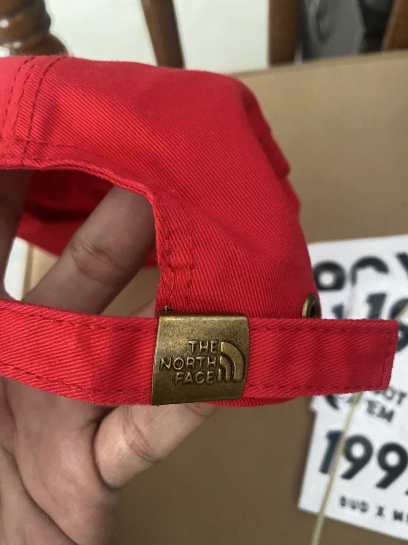 The North Face Simple Logo Cap Red (Category: Caps & Hats) located in Mangaldan. Submitted by startph (Listing ID 1463529232, Image 2). Description: - Brand: The North Face - Color: Red - Design: Simple logo - Strap: Adjustable with metal buckle - Condition: Brand new with tag attached - Origin: Made in China - Ideal for: Everyday wear.