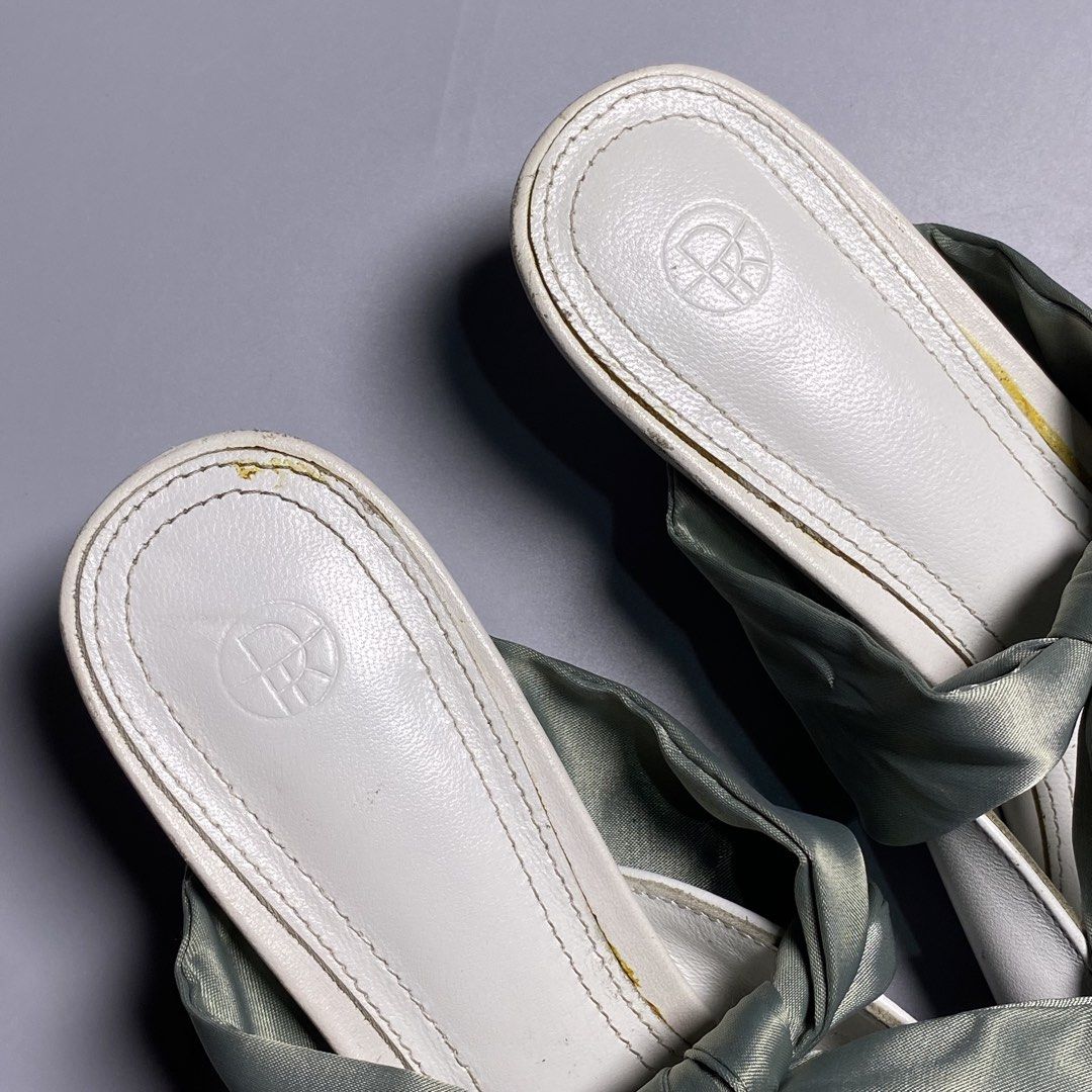 The Row Kitten Heel Coco Leather Mules (Category: Heels) located in Bacolod City. Submitted by quiarakazelxx (Listing ID 1463475948, Image 3). Description: Size: 37 Flaws: Just a normal sign of used •(See last pic) •Comes With iconic Coco Leather Mules by luxury fashion house The Row, Featuring their distinct pointed-toe silhouette, low kitten heel, and oversized satin-ribbon bow Pm for more details📩.