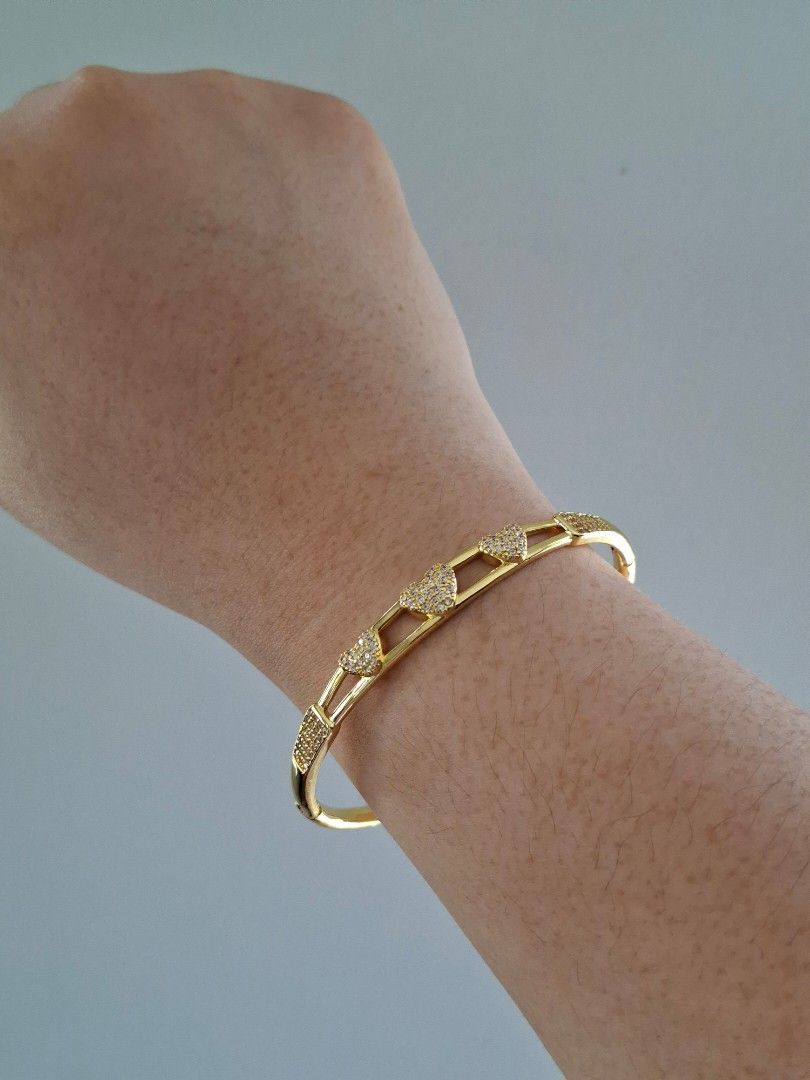 Three Hearts Gold Bangle Bracelet (Category: Bracelets) located in Dasmarinas. Submitted by danabrie22 (Listing ID 1463398080, Image 3). Description: very well-made, excellent crafstmanship 10/10 condition brand new stainless steel & white crystal-colored cubic zirconia stones made in Hongkong.