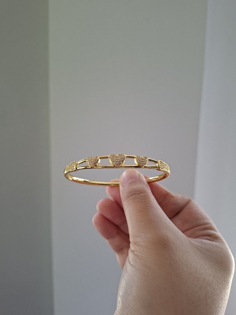 Three Hearts Gold Bangle Bracelet (Category: Bracelets) located in Dasmarinas. Submitted by danabrie22 (Listing ID 1463398080, Image 2). Description: very well-made, excellent crafstmanship 10/10 condition brand new stainless steel & white crystal-colored cubic zirconia stones made in Hongkong.