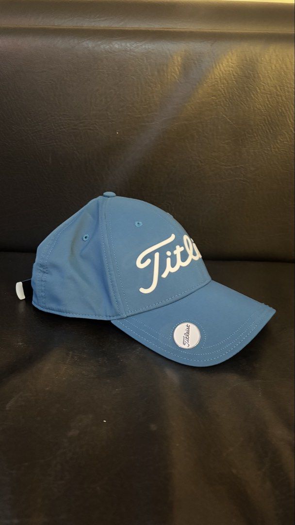 Titleist Golf Cap - Blue green (Category: Caps & Hats) located in Makati City. Submitted by jules000 (Listing ID 1463427921, Image 2). Description: - Classic blue Titleist golf cap - Features embroidered Titleist script logo on the front - Includes a small Titleist ball marker attached to the brim - Adjustable strap at the back for a customized, comfortable fit - Ideal for protection and style on the golf course on sunny days.
