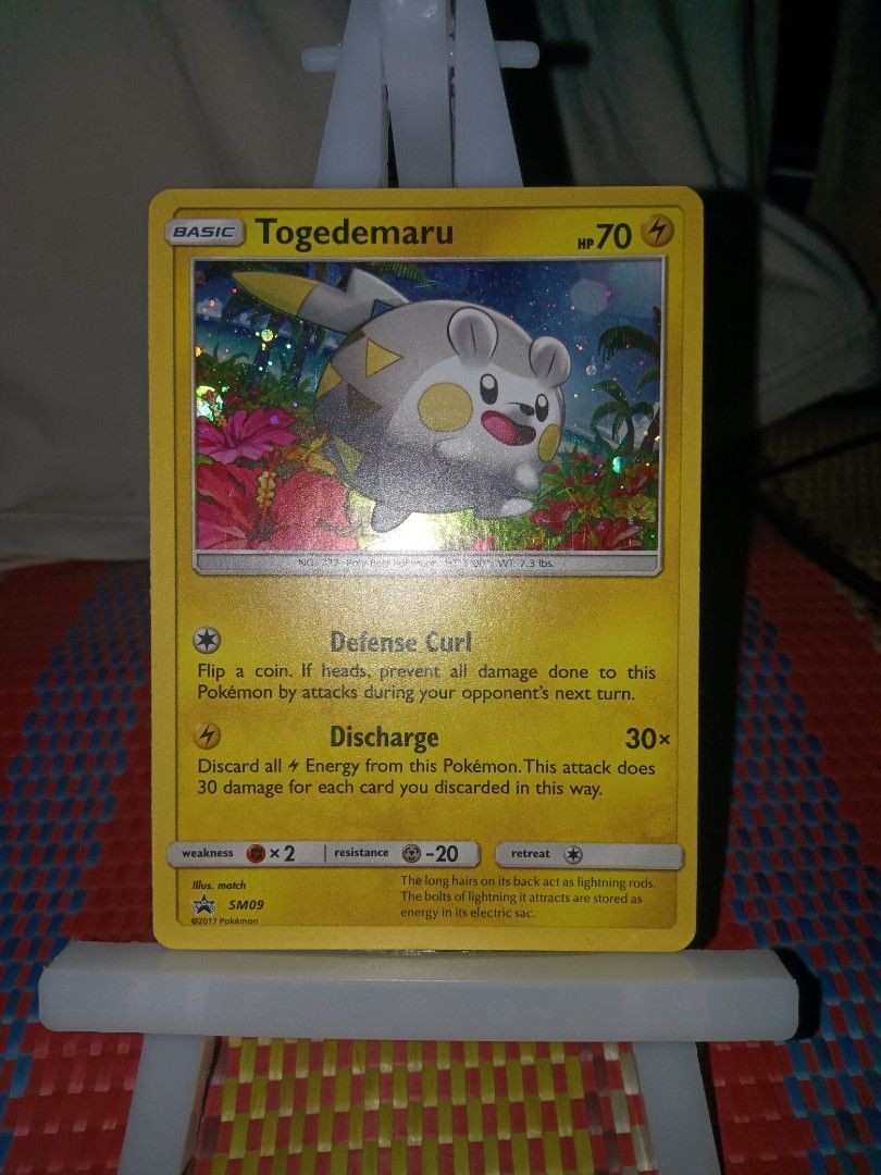 Togedemaru holo PROMO (Category: Raw Singles) located in Cagayan de Oro. Submitted by baksee (Listing ID 1463380314, Image 1). Description: Moderately Played.