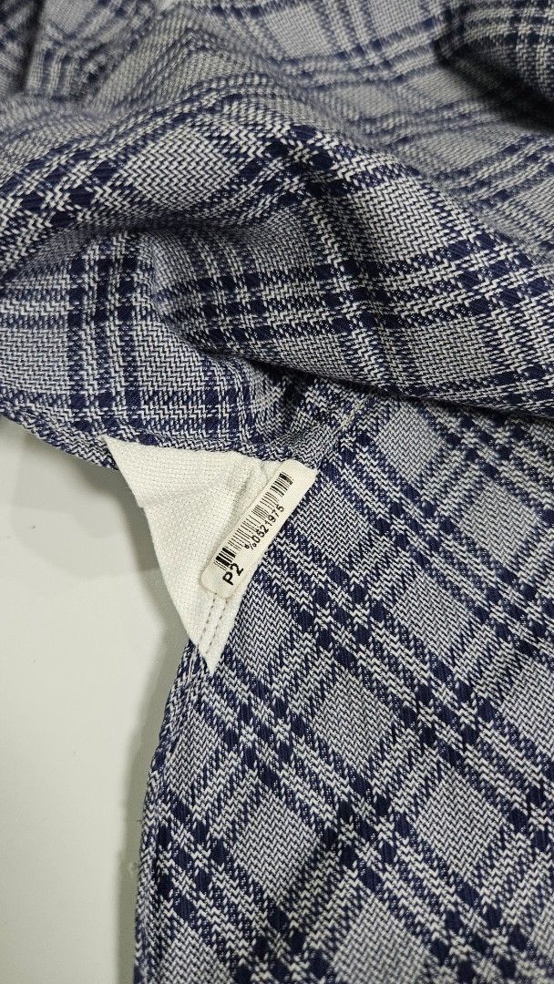 TOM FORD Plaid Button-Up Shirt (Category: Tshirts & Polo Shirts ) located in Alfonso. Submitted by jbcamet (Listing ID 1463522028, Image 3). Description: - Classic Tom Ford button-up shirt - Subtle navy and grey plaid pattern - Long sleeves with button cuffs - Made in Italy - Ideal for smart casual or formal wear - Check label for size details.