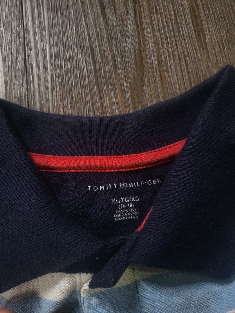 Tommy Hilfiger Polo Shirt (Category: Tshirts & Polo Shirts ) located in Quezon City. Submitted by w_shawnyyy (Listing ID 1463381160, Image 2). Description: Tommy Hilfiger Polo Shirt - Blue with Multicolor Stripes - No issues - Not Thrifted, personal clothes Length- 28.5in Chest- 19in Location: Near SM Fairview Shipping: Lalamove, Jnt (buyer shoulders sf) .