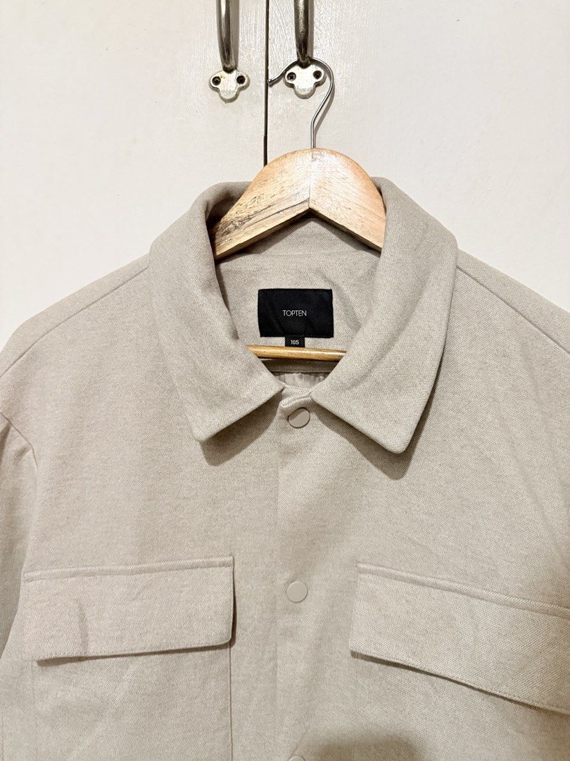TOP TEN Beige Button-Up Jacket with Chest Pockets (Category: Coats, Jackets and Outerwear) located in Cebu City. Submitted by jamesantho62588 (Listing ID 1463372761, Image 3). Description: - Beige jacket from TOP TEN - Two chest pockets with button closures - Simple button-up front - Relaxed fit, ideal for layering.