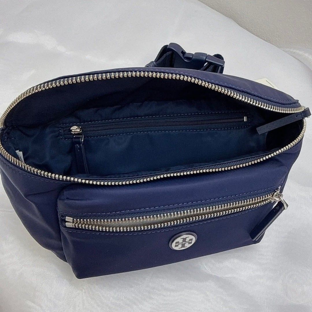 Tory Burch Navy Nylon Belt Bag (Category: Luxury Bags & Wallets) located in Pagadian. Submitted by patrickjames18 (Listing ID 1463472048, Image 3). Description: - Tory Burch Navy Blue Nylon Belt Bag - Silver Hardware and Zippers - Main Compartment with Interior Zip Pocket - Front Zip Pocket - Adjustable Strap - Made in Cambodia - Ideal for Everyday Use or Travel.