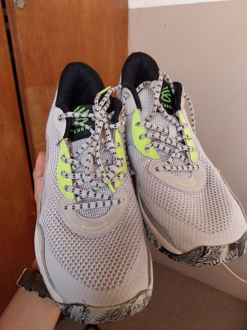 Under Armour Curry 3Z 24 Suede (Category: Sneakers) located in Manila. Submitted by j.dlh (Listing ID 1463355976, Image 2). Description: - Under Armour Curry 7 Youth Basketball Shoes - Authentic - Size: 7Y - Color: White with neon green accents and black toe - Laces: Grey and black with neon green tips - Origin: Made in Indonesia - Perfect for basketball or everyday wear.