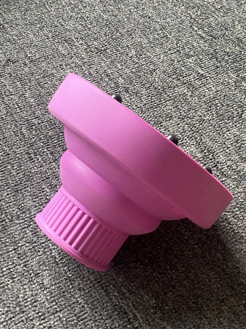 Universal Collapsible Diffuser Attachment (Category: Hair) located in Makati City. Submitted by clutterfree.life (Listing ID 1463389004, Image 2). Description: - Purple hair dryer diffuser attachment - Fits most standard hair dryers - Creates volume and reduces frizz - Collapsible design for easy storage and travel - Ideal for curly or wavy hair Used only twice. .