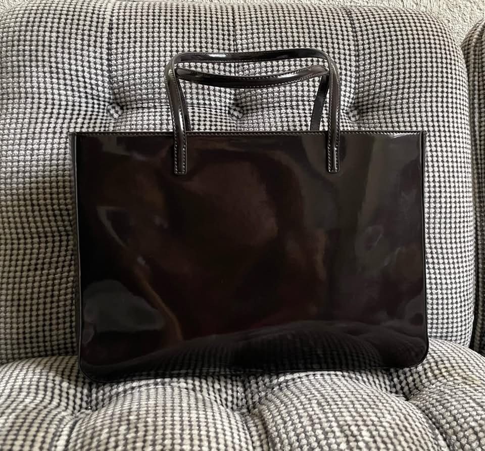 Unused Foxey patent leather shoulder bag (Category: Shoulder Bags) located in Bulacan. Submitted by thriftbagcollections (Listing ID 1463459018, Image 1). Description: Unused Foxey patent leather shoulder bag with dustbag,dark brown color.Approx:H-4.3”W-8.5”D-2.5”.