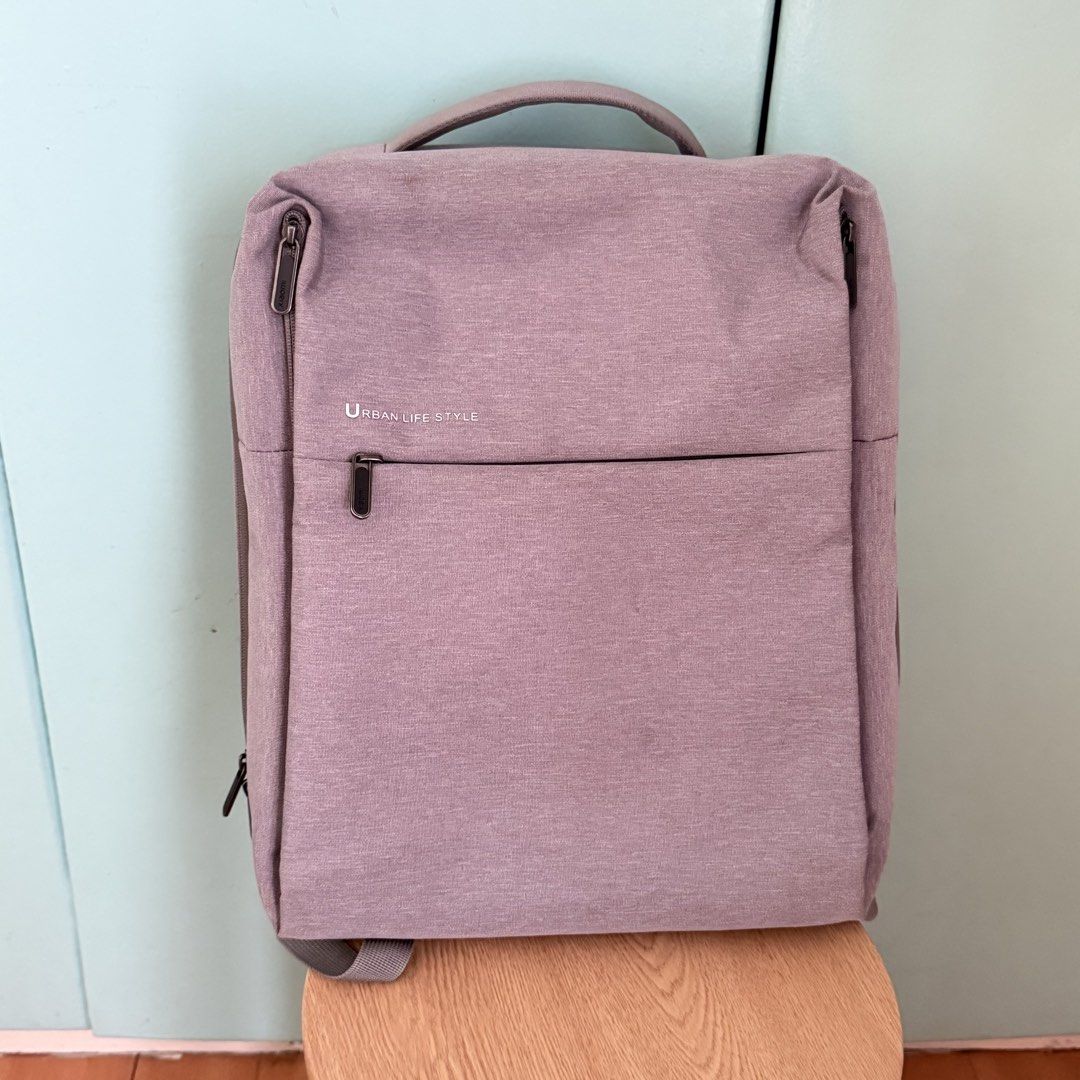 Urban Life Style Grey Backpack (Category: Backpacks) located in Cebu City. Submitted by eynjlin (Listing ID 1463474194, Image 1). Description: - Grey backpack with "URBAN LIFE STYLE" text - Main compartment for storage - Front zip pocket for quick access - Padded straps and back for enhanced comfort - Ideal for daily commutes or travel adventures - Zippers are smooth and fully functional - Bag is clean inside and out.