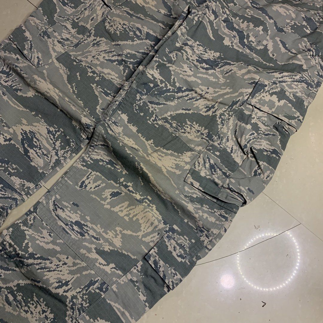 US Air Force Camo Cargo Pants (Category: Jeans) located in Alaminos. Submitted by jikstocks (Listing ID 1463484662, Image 3). Description: - Genuine U.S. Air Force issue - Classic tiger stripe camouflage pattern - Multiple spacious cargo pockets - Made with durable, long-lasting material - Ideal for outdoor adventures or everyday casual style.