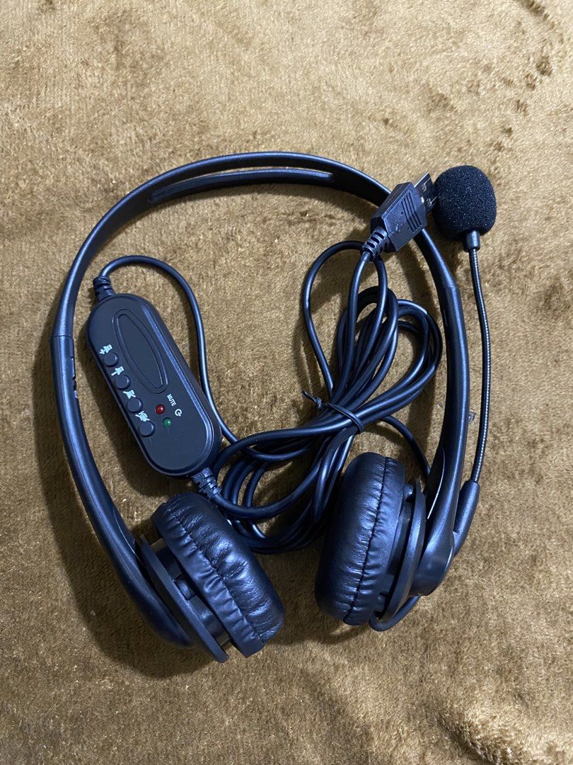 USB Headset with Microphone and In-line Controls (Category: Headphones & Headsets) located in Pateros City. Submitted by labulabs (Listing ID 1463449781, Image 1). Description: - Black USB headset with flexible microphone - In-line controls for mute and volume adjustment - Padded earcups for maximum comfort - Coiled cable for neat and tangle-free storage - Ideal for online calls, virtual meetings, and more.