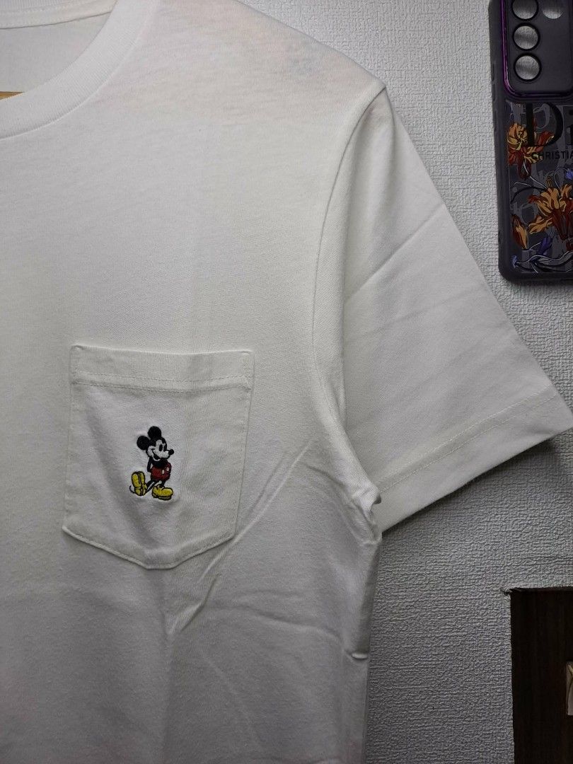 UT Uniqlo x Mickey Mouse (Category: Shirts) located in Manila. Submitted by yaseen__73 (Listing ID 1463399156, Image 2). Description: UT Uniqlo Pocket Tee White x Disney Mickey Mouse Cotton 💯 Wearing Size : Medium on Tag Dimensions : See Photo Color Rate : 9.9/10 Needs Re - Wash In Excellent Condition 350.00 Shipped Via J&T Express Around Metro Manila MOP : G C A S H B A N K T R A N S F E R Seller's Location: 📍Brgy. Pansol, Q.C.
