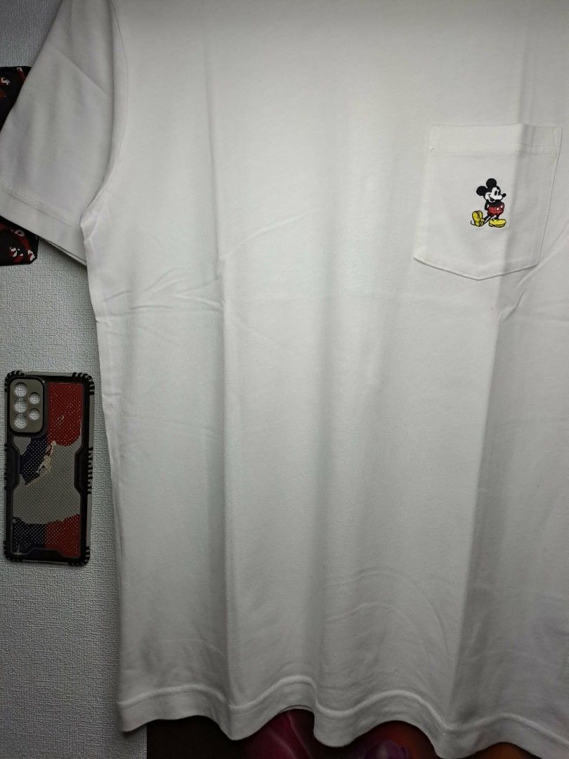 UT Uniqlo x Mickey Mouse (Category: Shirts) located in Manila. Submitted by yaseen__73 (Listing ID 1463399156, Image 3). Description: UT Uniqlo Pocket Tee White x Disney Mickey Mouse Cotton 💯 Wearing Size : Medium on Tag Dimensions : See Photo Color Rate : 9.9/10 Needs Re - Wash In Excellent Condition 350.00 Shipped Via J&T Express Around Metro Manila MOP : G C A S H B A N K T R A N S F E R Seller's Location: 📍Brgy. Pansol, Q.C.