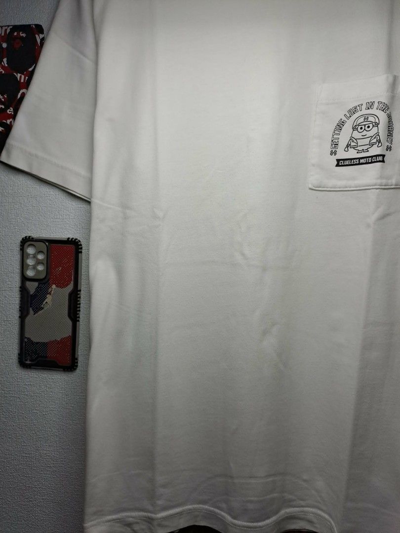 UT Uniqlo x Minions Pocket Tee (Category: Tshirts & Polo Shirts ) located in Manila. Submitted by yaseen__73 (Listing ID 1463410216, Image 3). Description: White Uniqlo UT Minions collaboration graphic pocket T-shirt featuring a small character print on the left chest pocket. Wearing Size : Large on Tag Dimensions : See Photo Color Rate : 9.9/10 Needs Re - Wash In Excellent Condition 400.00 Shipped Via J&T Express Around Metro Manila MOP : G C A 