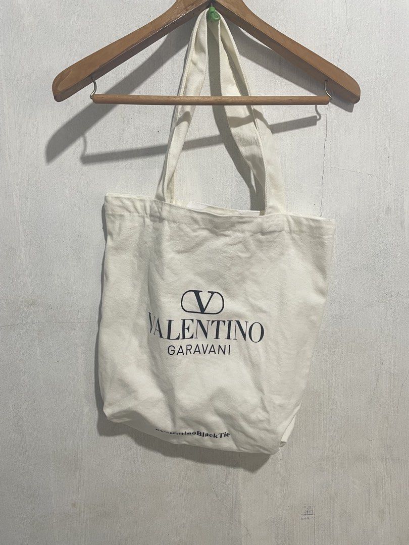 Valentino tote canvas bag (Category: Luxury Bags & Wallets) located in Davao. Submitted by mj_designervintagecurator (Listing ID 1463360622, Image 2). Description: 📌In good condition no holes on edges 📌15 inches length / 14 width.