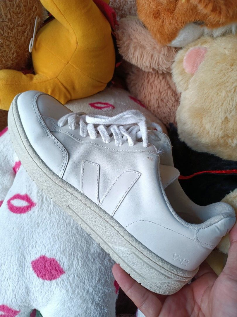 Veja V-12 Leather Sneakers White (Category: Sneakers) located in Manila. Submitted by pnjdianne25879 (Listing ID 1463429158, Image 3). Description: - White Veja V-12 sneakers - Genuine leather material - Classic lace-up, low-top design - Perfect for everyday wear - Minor scuffs on sole and toe area - Overall in decent, wearable condition.