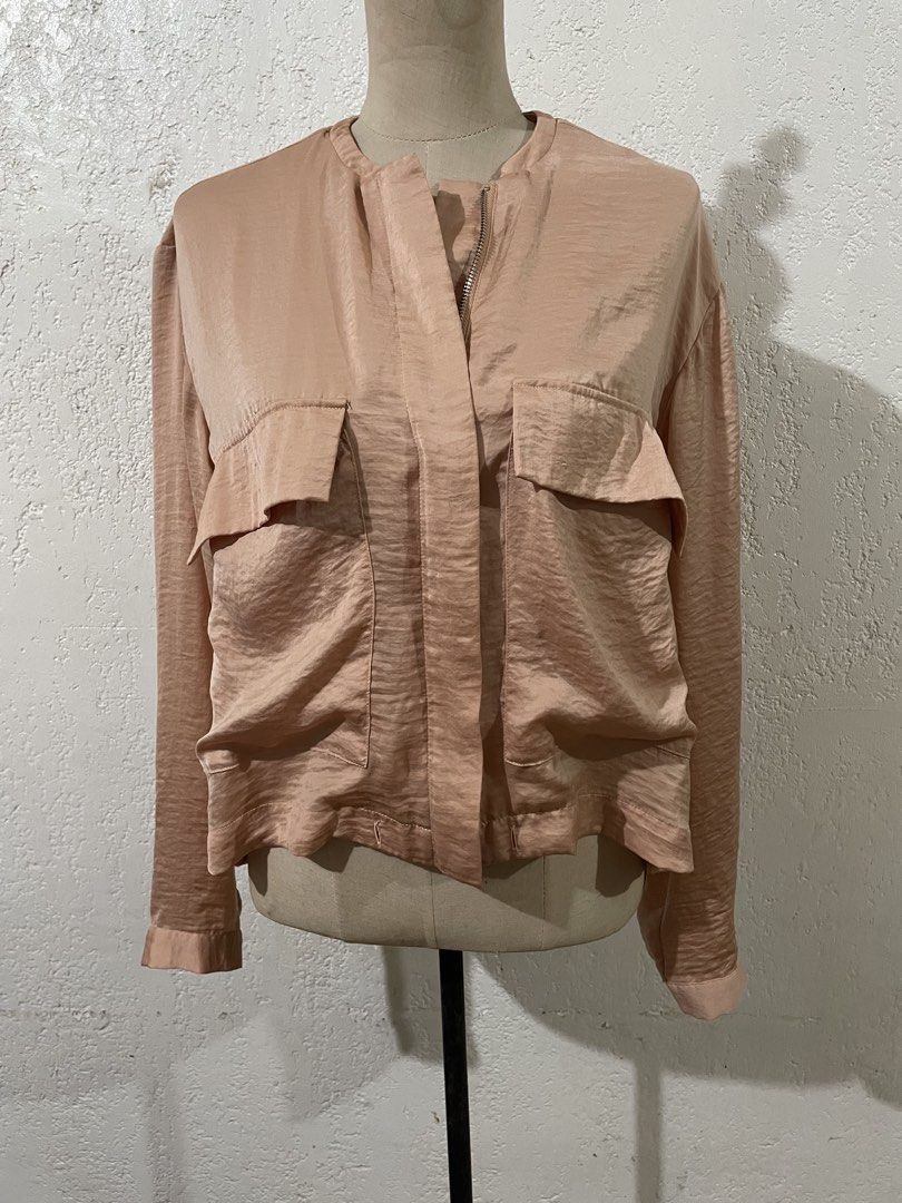 VERO MODA Satin Bomber Jacket Style Blouse (Category: Blouses) located in Talisay. Submitted by mrjannchristian (Listing ID 1463477310, Image 2). Description: - Lightweight satin fabric with a subtle sheen and texture - Bomber jacket inspired design - Full zip-up front closure - Two functional chest pockets - Long sleeves with button cuffs - Versatile styling: perfect for dressing up or down - Pairs well with jeans or trousers.