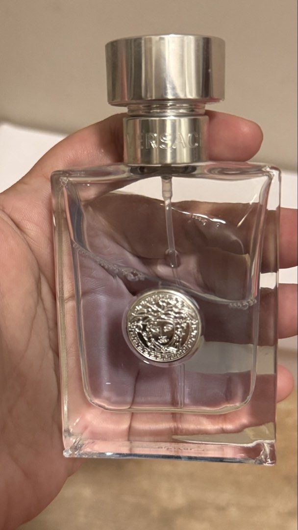 Versace Pour Homme Eau de Toilette (Category: Fragrance & Deodorants) located in Pasig City. Submitted by sdpii (Listing ID 1463472951, Image 2). Description: - Versace Pour Homme Eau de Toilette - Bottle is clear glass with a silver cap featuring the iconic Medusa head emblem. - Fragrance liquid is a light blue color. - Approximately 3/4 of the original volume remains. - Ideal scent for everyday wear. Super bango - Bought in the US - RFS: need f