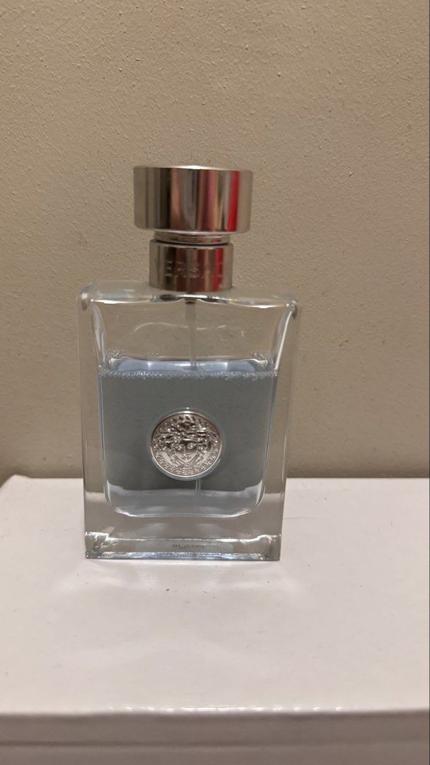 Versace Pour Homme Eau de Toilette (Category: Fragrance & Deodorants) located in Pasig City. Submitted by sdpii (Listing ID 1463472951, Image 1). Description: - Versace Pour Homme Eau de Toilette - Bottle is clear glass with a silver cap featuring the iconic Medusa head emblem. - Fragrance liquid is a light blue color. - Approximately 3/4 of the original volume remains. - Ideal scent for everyday wear. Super bango - Bought in the US - RFS: need f