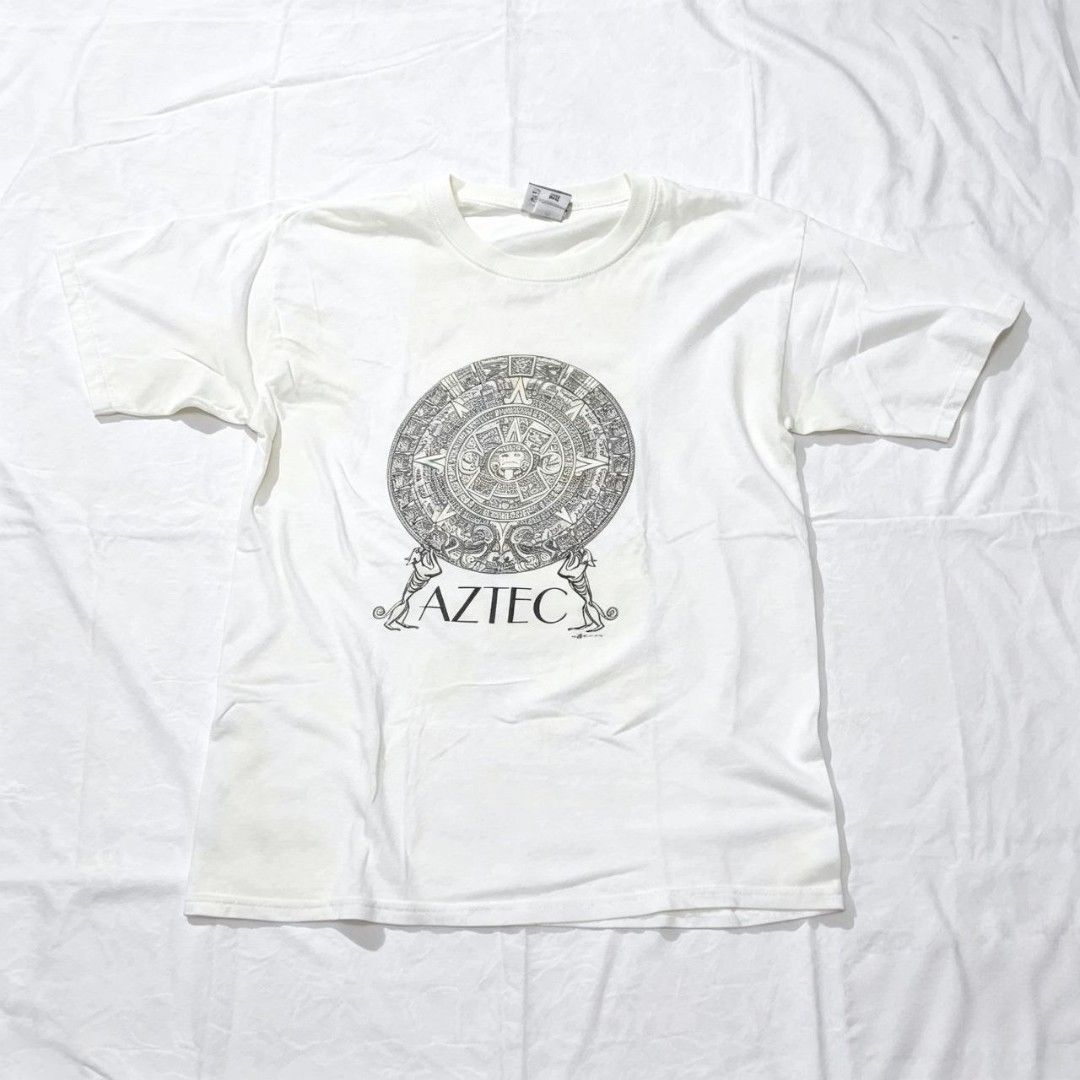 Vintage Aztec Tee (Category: Tshirts & Polo Shirts ) located in Quezon City. Submitted by rodthrift00 (Listing ID 1463368452, Image 1). Description: Best Fit: L-XL Dimension(WxL) : 21x29 Condition: 9/10 Issue: Stains.