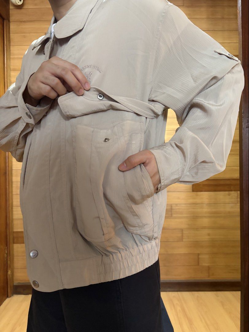 Vintage Current Stage Beige Bomber Jacket with Pockets (Category: Coats, Jackets and Outerwear) located in Las Pinas. Submitted by cmrqz (Listing ID 1463370812, Image 3). Description: - Lightweight beige bomber jacket - Collared neckline - Button-up front - Two chest pockets with button closures - Two large side pockets - Elasticated cuffs and hem.