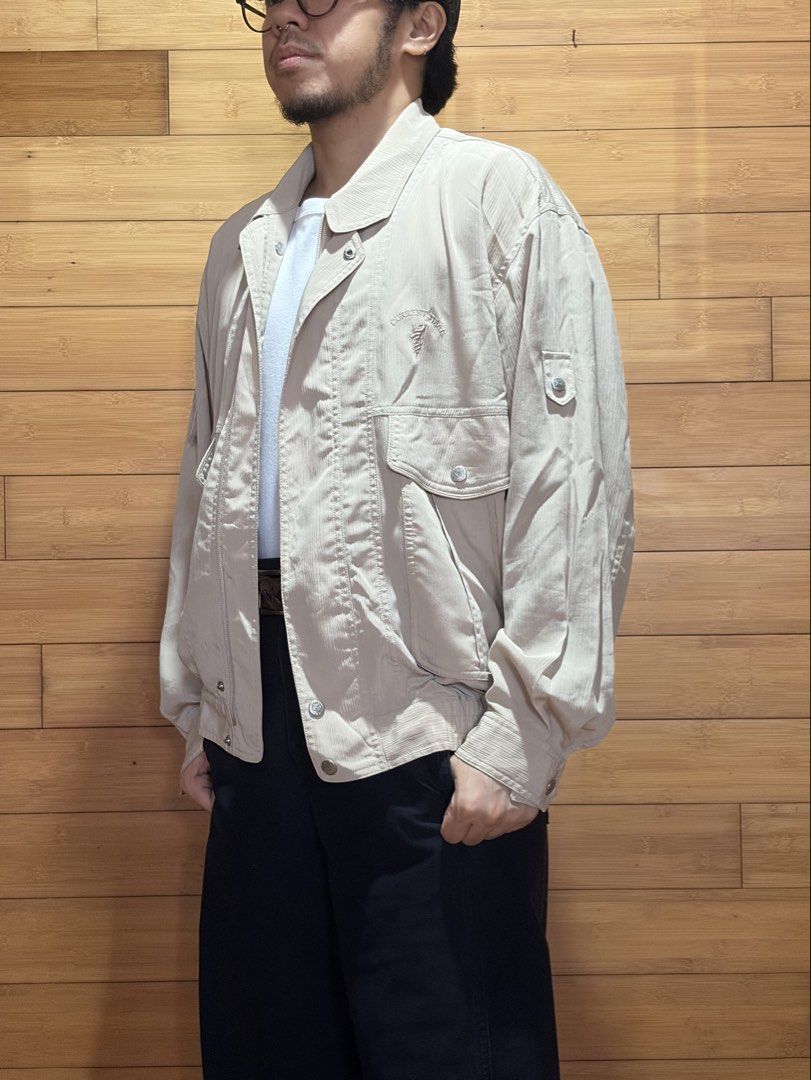 Vintage Current Stage Beige Bomber Jacket with Pockets (Category: Coats, Jackets and Outerwear) located in Las Pinas. Submitted by cmrqz (Listing ID 1463370812, Image 2). Description: - Lightweight beige bomber jacket - Collared neckline - Button-up front - Two chest pockets with button closures - Two large side pockets - Elasticated cuffs and hem.