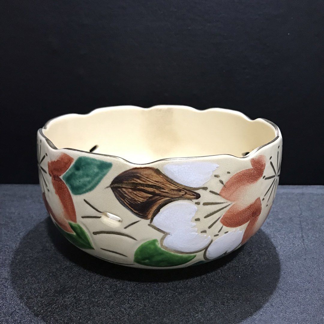 Vintage Ceramic Bowl with Floral Design (Category: Vases & Decorative Bowls) located in Baao. Submitted by all.things.japan (Listing ID 1463550802, Image 1). Description: 7.0 (d) x 4.0 (h) inches - Cream-colored ceramic bowl - Scalloped rim with small decorative holes - Hand-painted floral motifs (red, green, white, brown) - Glossy interior finish - Ideal for serving dishes or as a decorative accent piece.