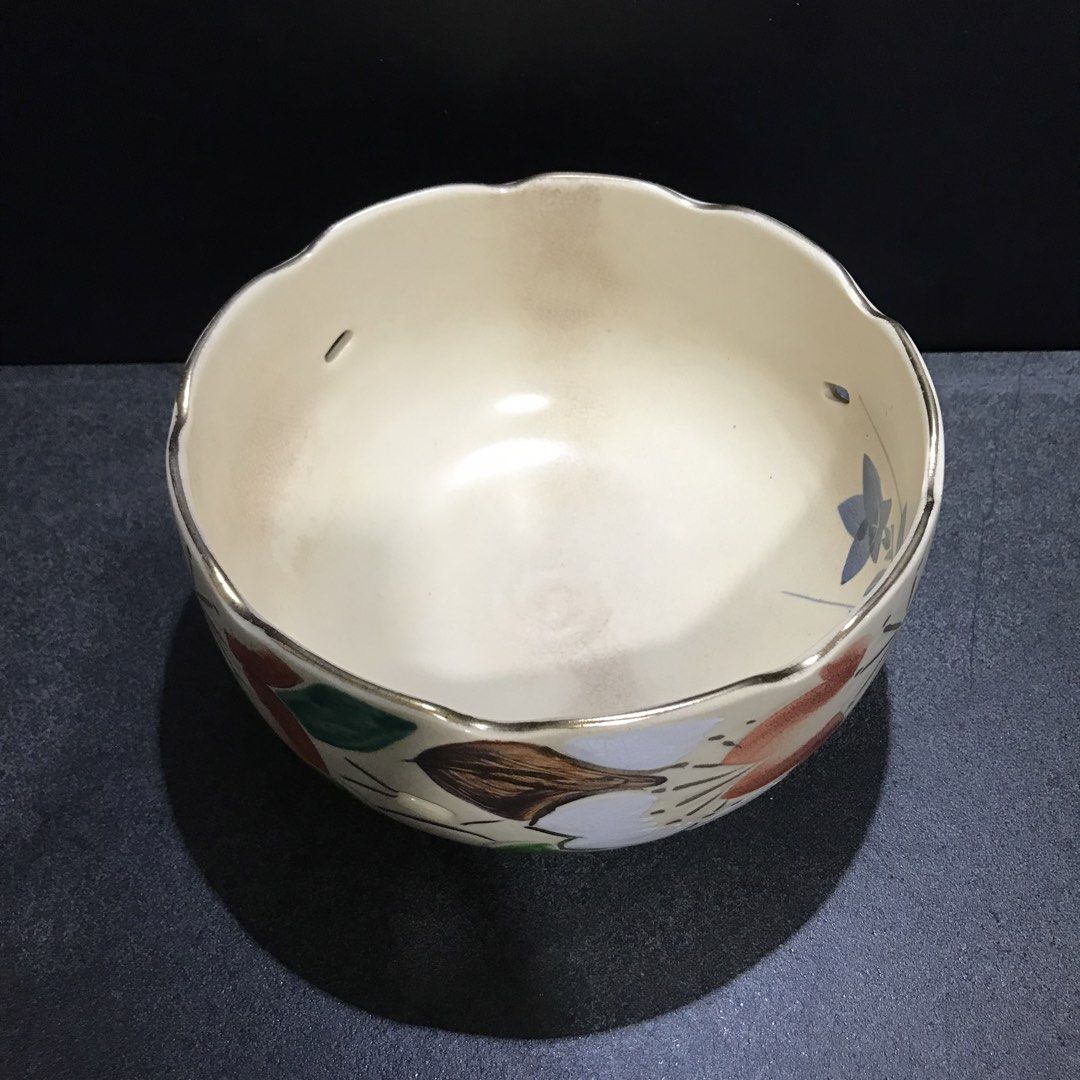 Vintage Ceramic Bowl with Floral Design (Category: Vases & Decorative Bowls) located in Baao. Submitted by all.things.japan (Listing ID 1463550802, Image 3). Description: 7.0 (d) x 4.0 (h) inches - Cream-colored ceramic bowl - Scalloped rim with small decorative holes - Hand-painted floral motifs (red, green, white, brown) - Glossy interior finish - Ideal for serving dishes or as a decorative accent piece.
