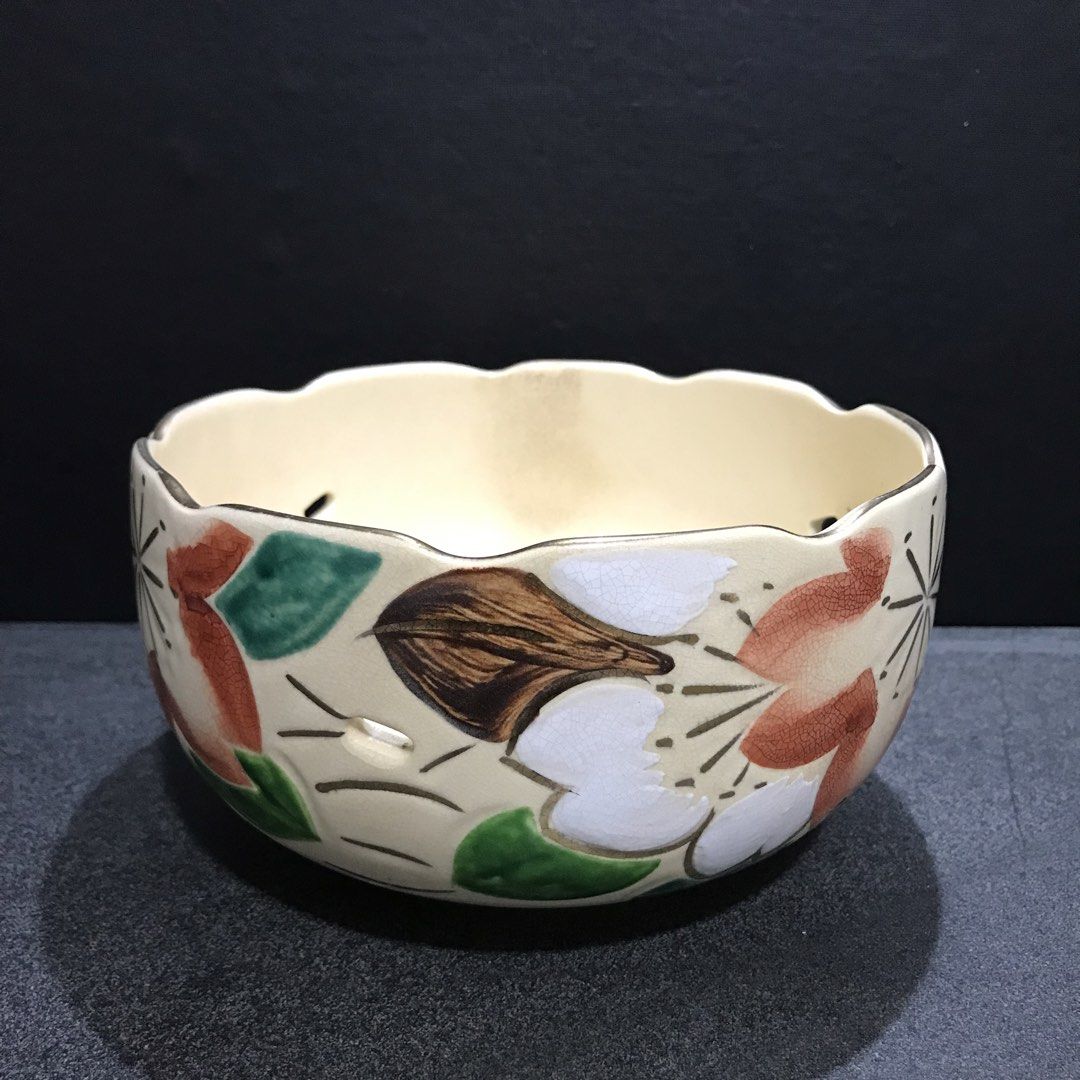 Vintage Ceramic Bowl with Floral Design (Category: Vases & Decorative Bowls) located in Baao. Submitted by all.things.japan (Listing ID 1463550802, Image 2). Description: 7.0 (d) x 4.0 (h) inches - Cream-colored ceramic bowl - Scalloped rim with small decorative holes - Hand-painted floral motifs (red, green, white, brown) - Glossy interior finish - Ideal for serving dishes or as a decorative accent piece.