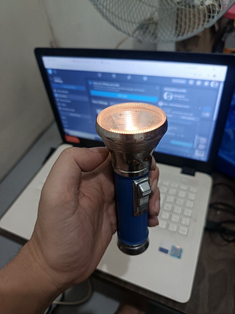 Vintage Classic Chrome Head Flashlight (Blue Ribbed Body) – Tested & Working (Category: Travel Essentials & Accessories) located in Cebu City. Submitted by turuuru8992423 (Listing ID 1463351968, Image 2). Description: Vintage Classic Chrome Head Flashlight (Blue Ribbed Body) – Tested & Working Description: Classic vintage-style handheld flashlight with a shiny chrome reflector head and blue ribbed body. Features a traditional slider switch and wa