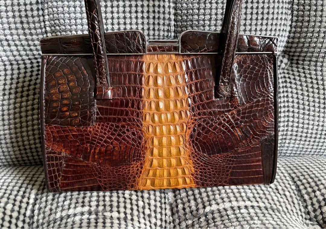 Vintage Crocodile skin clutch (Category: Clutches) located in Bulacan. Submitted by thriftbagcollections (Listing ID 1463458687, Image 3). Description: Vintage Crocodile skin clutch,good condition! Approx:H-5.6”W-8.5”D-2.5” handle6.5”.