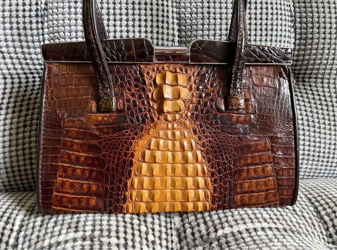 Vintage Crocodile skin clutch (Category: Clutches) located in Bulacan. Submitted by thriftbagcollections (Listing ID 1463458687, Image 2). Description: Vintage Crocodile skin clutch,good condition! Approx:H-5.6”W-8.5”D-2.5” handle6.5”.