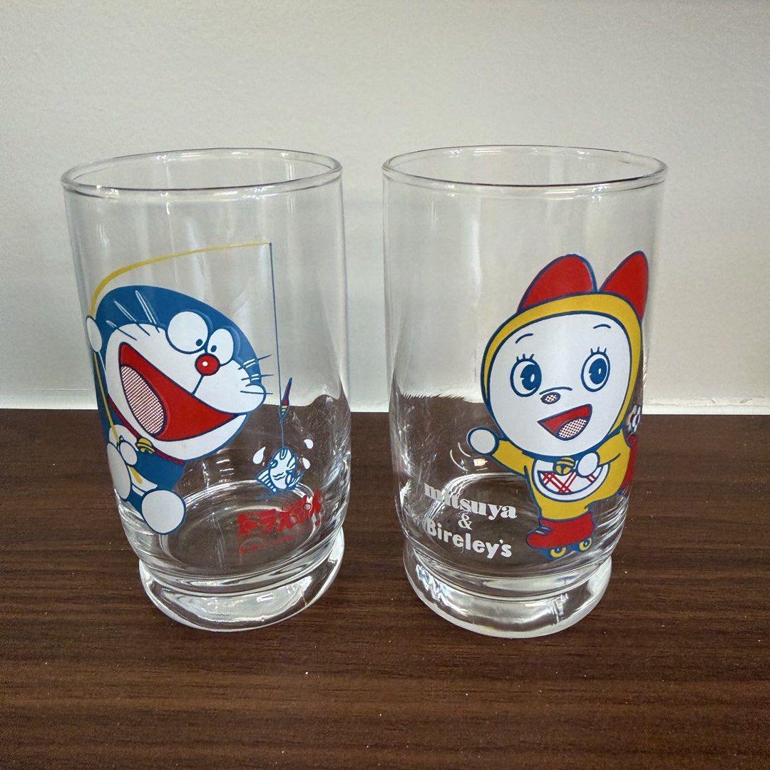 Vintage drinking glasses featuring Doraemon and Dorami-chan (Category: Vintage Collectibles) located in Bulacan. Submitted by prelovedetc (Listing ID 1463326651, Image 2). Description: This is a set of two 1980s vintage glasses Japanese promotional drinking glasses featuring Doraemon and Dorami-chan. They have a retro Showa-era feel and are recommended as collector's items. Brand new and comes with the original old box..