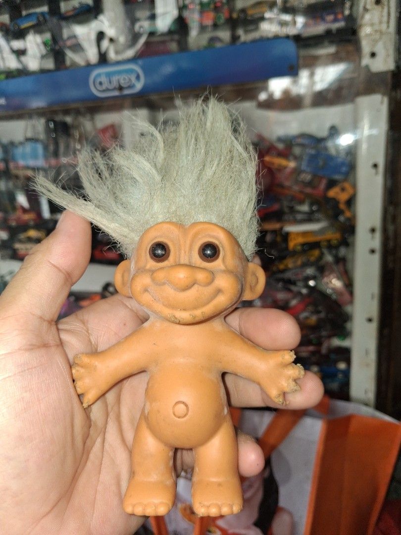 Vintage Russ Troll Doll Toy (Category: Plushies & Soft Toys) located in Manila. Submitted by marcas022798212 (Listing ID 1463348570, Image 1). Description: - Vintage Russ troll doll - Orange body with white hair - Shows some marks and wear on body and feet - Hair is a bit messy - Retains its original charm - Perfect for collectors or as a quirky decor piece.