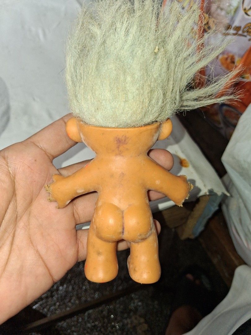 Vintage Russ Troll Doll Toy (Category: Plushies & Soft Toys) located in Manila. Submitted by marcas022798212 (Listing ID 1463348570, Image 2). Description: - Vintage Russ troll doll - Orange body with white hair - Shows some marks and wear on body and feet - Hair is a bit messy - Retains its original charm - Perfect for collectors or as a quirky decor piece.