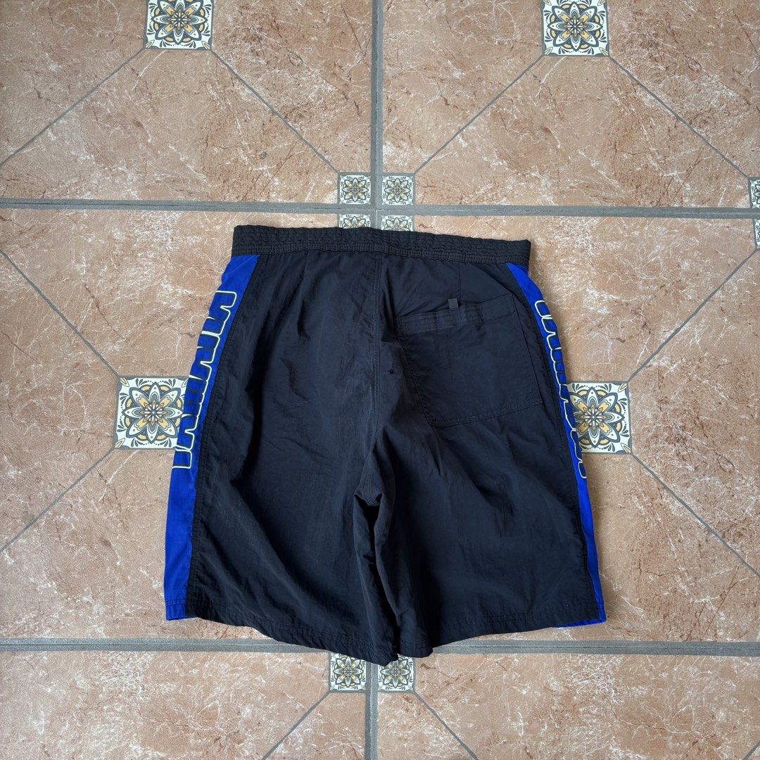 Vintage yamaha ride short (Category: Shorts) located in San Fernando. Submitted by diff.thr1ft (Listing ID 1463342329, Image 1). Description: - Vintage Yamaha ride shorts - Size: Medium - Color: Black with blue and white Yamaha side accents - Material: Durable fabric (likely nylon blend based on tag) - Condition: Good, pre-loved vintage item - Design: Classic Yamaha branding on sides - Origin: Made in Mexico - Perfect for riders and Yamaha fans.