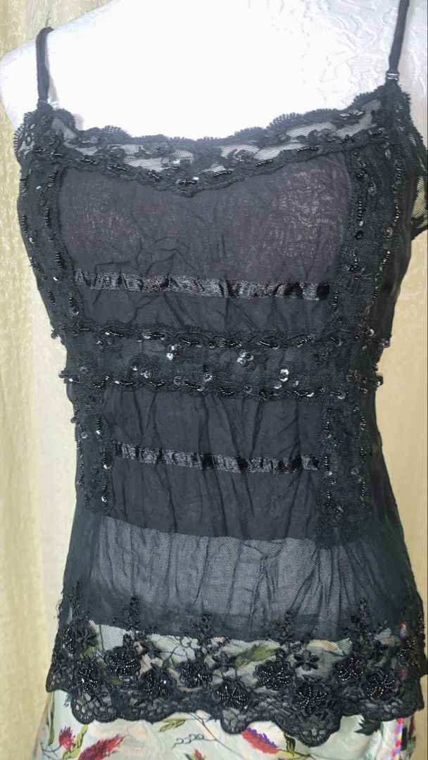Volage Black Lace Sequin Camisole Top (Category: Sleeveless) located in Dagupan City. Submitted by sj_styles0910. (Listing ID 1463531767, Image 2). Description: - Brand: Volage - Color: Black - Style: Camisole top - Features: Delicate lace trim, sequin details, ribbon accents - Fabric: Sheer - Hem: Scalloped lace - Straps: Adjustable spaghetti straps - Versatile: Great for layering or wearing solo.