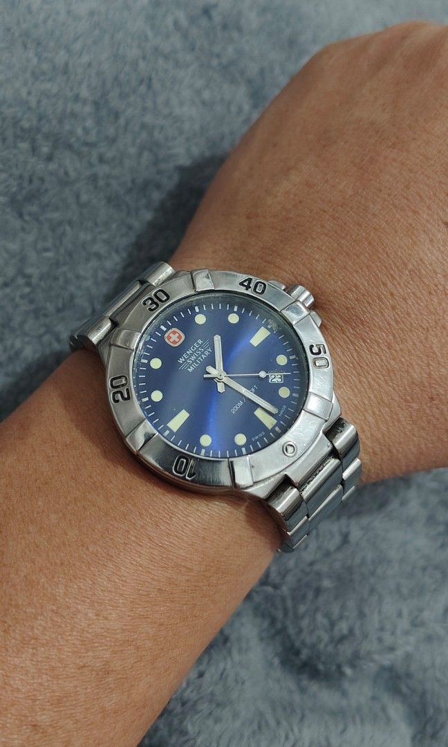 Wenger Swiss Military (Category: Men's Watches) located in Cebu City. Submitted by aceoftime (Listing ID 1463524158, Image 2). Description: In good working condition Swiss Made Analog quartz with date display Blue dial in stainless steel case & bracelet 200m water resist Watch only Our Guarantee: 💯 Authentic All watches are checked by our experienced technician to ensure good functionality Please manage your expectations since these are preloved
