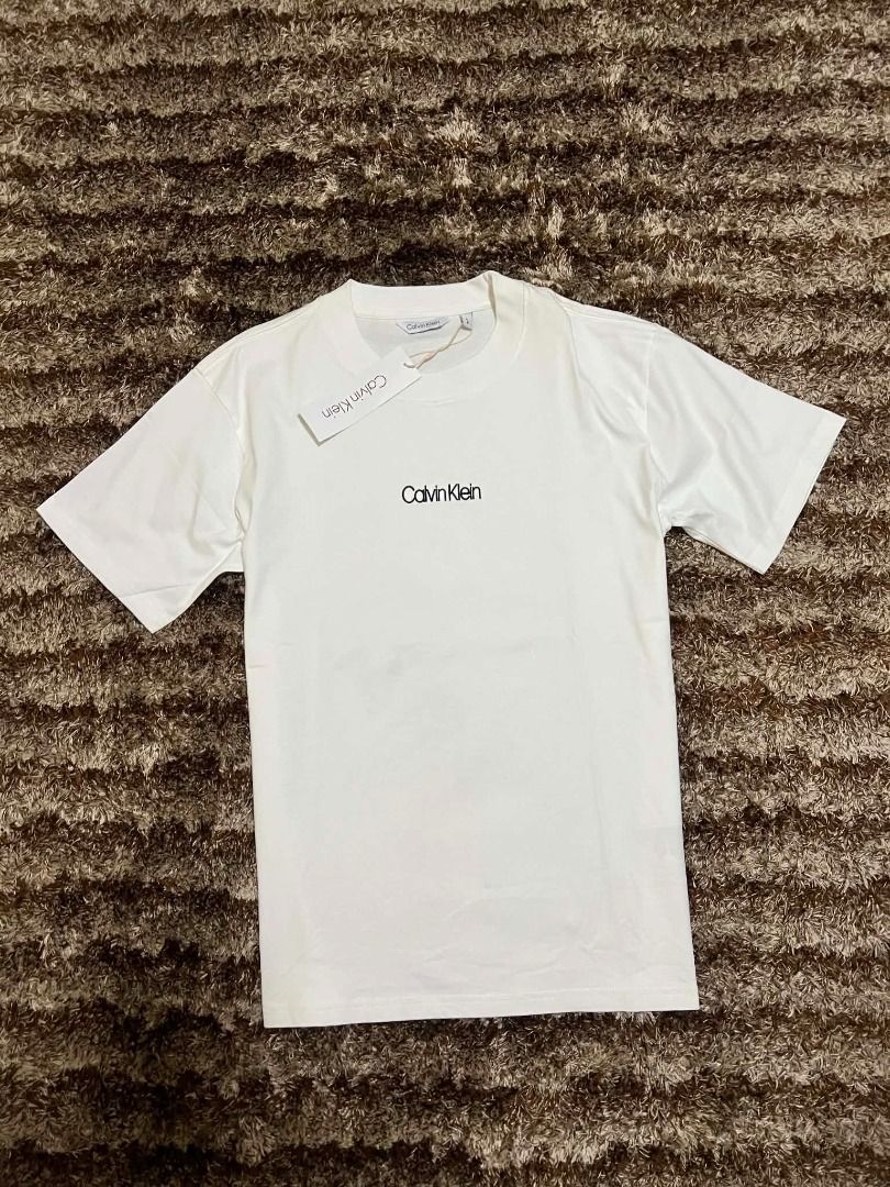 White Calvin Klein Original T Shirt (Category: Tshirts & Polo Shirts ) located in Manila. Submitted by actd_luxury (Listing ID 1463539332, Image 1). Description: l: 22x28.