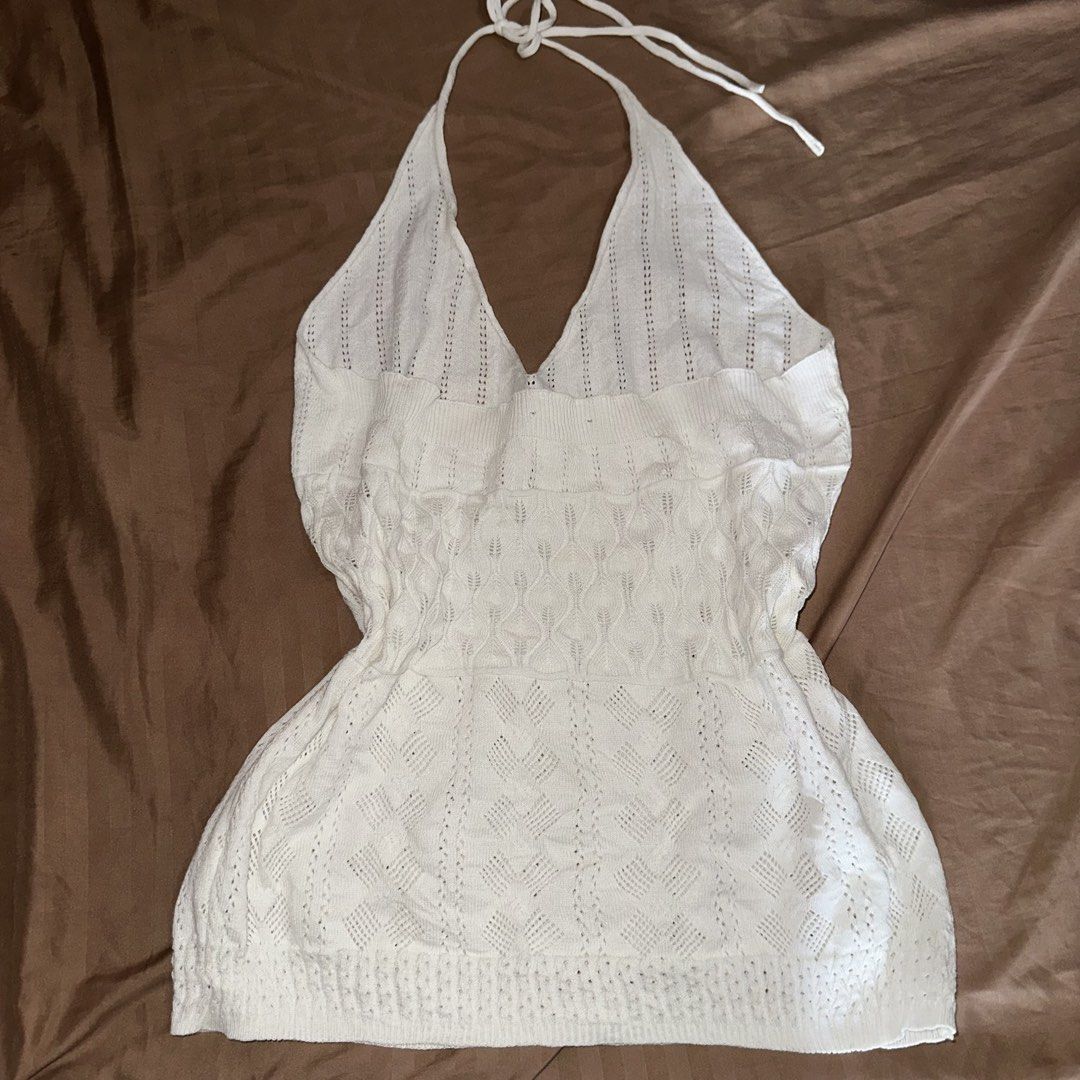 White Crochet Halter Top Cover Up (Category: Sleeveless) located in Manila. Submitted by daintywears (Listing ID 1463345224, Image 2). Description: manage your expectations this is a thrifted item. flaw: meron lang minor hole sa back but not noticeable at all. see photos - White crochet halter top - Sweetheart neckline with tie closure - Ribbed band under bust - Open knit pattern - Ideal for beach days or layering - Two small dark marks near neck