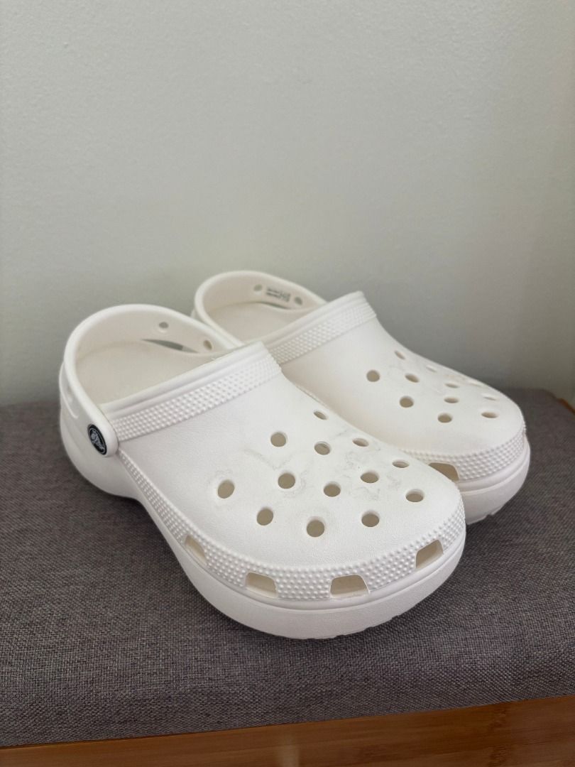 White Crocs Platform Clogs (Category: Slippers and slides) located in Cebu City. Submitted by bml_vault (Listing ID 1463371799, Image 2). Description: M 4 | W 6 - White Crocs platform clogs - Classic design with pivoting heel strap - Easy to clean and comfortable for everyday wear - Light markings from Jibbitz, as shown in photos - Great for casual outings.