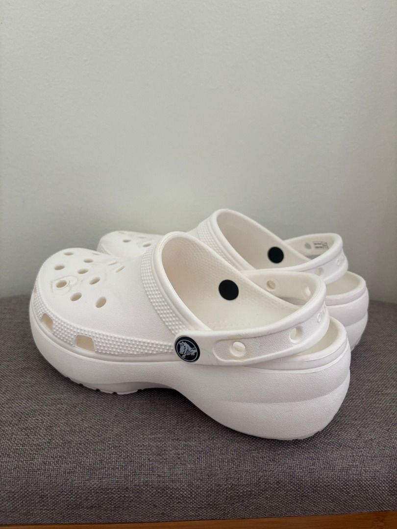 White Crocs Platform Clogs (Category: Slippers and slides) located in Cebu City. Submitted by bml_vault (Listing ID 1463371799, Image 3). Description: M 4 | W 6 - White Crocs platform clogs - Classic design with pivoting heel strap - Easy to clean and comfortable for everyday wear - Light markings from Jibbitz, as shown in photos - Great for casual outings.