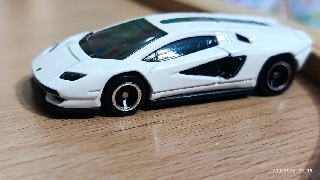 White Lamborghini Countach Toy Car (Category: Vehicle & Diecast Models) located in Quezon City. Submitted by manyigorot33447 (Listing ID 1463552311, Image 2). Description: - White Lamborghini Countach toy car - Detailed diecast model (similar to TOMICA) - Perfect for collectors and kids who love supercars - Suitable for display or play - Clean and ready for a new home AS IS WER IS.