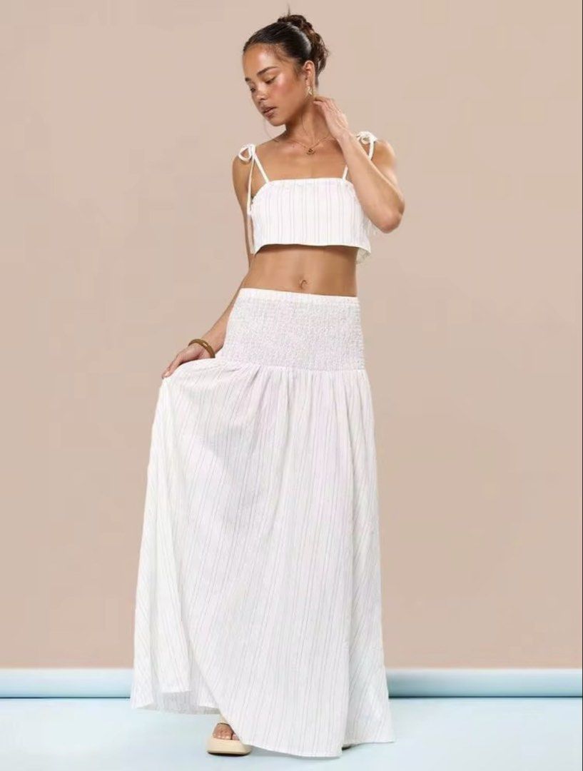 White Pinstripe Maxi Skirt ONLY (Category: Skirts) located in Villasis. Submitted by juliaxgamboa (Listing ID 1463515446, Image 1). Description: - XS to Small - Adorable white pinstripe skirt - Features a smocked-waist maxi skirt - Lightweight and flowy fabric - Ideal for beach days or summer outings - Effortless to wear and style.