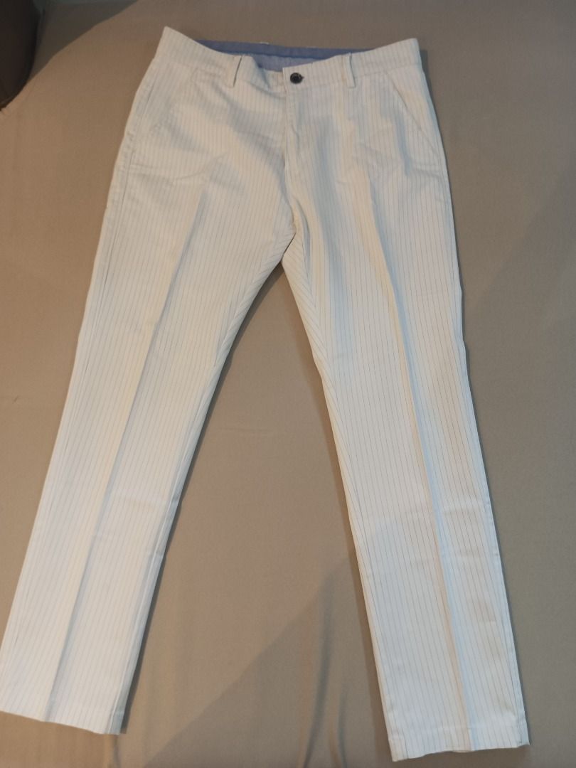 White Slacks (Category: Other Bottoms) located in Muntinlupa City. Submitted by irene.aragon.navarro (Listing ID 1463354386, Image 1). Description: - Classic white pants - Subtle pinstripe detail - Button and zip closure - Two side pockets - Comfortable fit for smart casual or formal wear - Ideal for work or a night out.