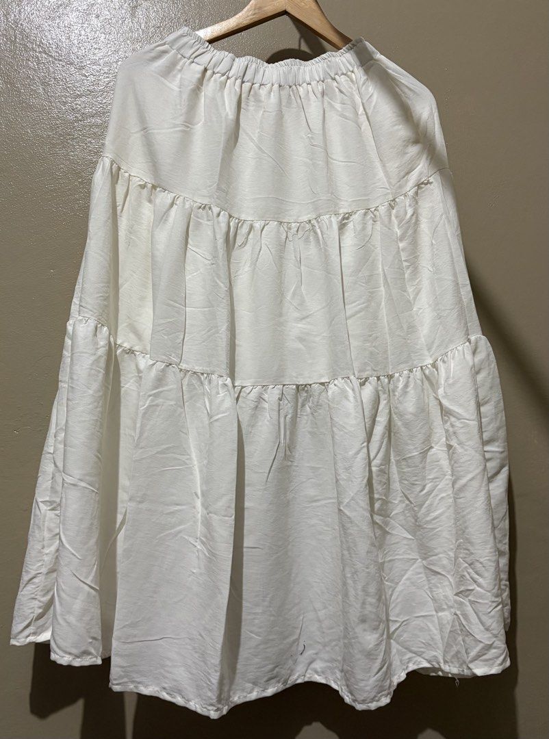 White Tiered Maxi Skirt (Category: Skirts) located in Manila. Submitted by stella_mari27 (Listing ID 1463455944, Image 1). Description: - Flowy white maxi skirt - Tiered ruffle design - Comfortable elastic waistband - Lightweight fabric - Ideal for casual wear or dressing up - Perfect for summer days.