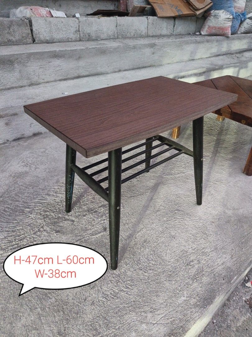 Wooden Coffee Table with Black Legs (Category: Tables & Sets) located in Valenzuela. Submitted by kendra071914 (Listing ID 1463467206, Image 1). Description: - Rectangular coffee table - Wood-grain top for a natural look - Sturdy black tapered legs - Convenient lower shelf for extra storage - Dimensions: Height 47cm, Length 60cm, Width 38cm - Ideal for living rooms or as a decorative accent piece.