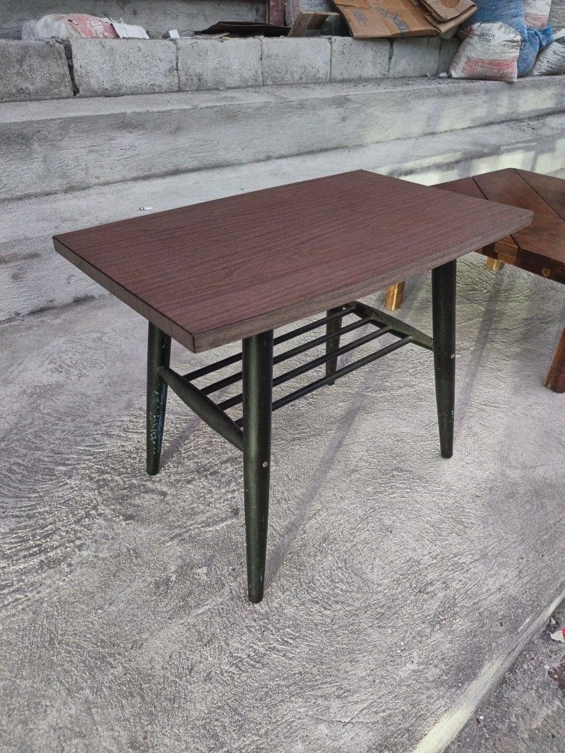 Wooden Coffee Table with Black Legs (Category: Tables & Sets) located in Valenzuela. Submitted by kendra071914 (Listing ID 1463467206, Image 2). Description: - Rectangular coffee table - Wood-grain top for a natural look - Sturdy black tapered legs - Convenient lower shelf for extra storage - Dimensions: Height 47cm, Length 60cm, Width 38cm - Ideal for living rooms or as a decorative accent piece.
