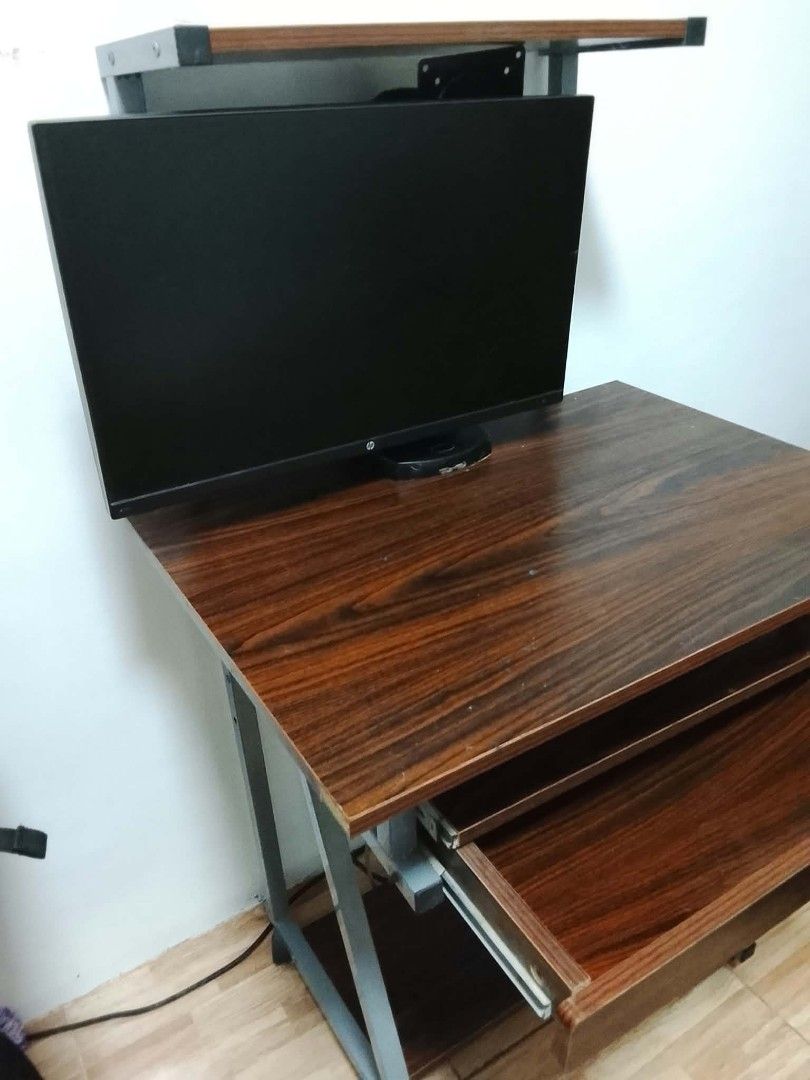 Wooden Computer Desk with printer Stand and Keyboard Tray (Category: Tables & Sets) located in Pasig City. Submitted by merl01 (Listing ID 1463531241, Image 2). Description: COMPUTER TABLE WITH PRINTER STAND & DRAWER Selling Price: ₱1,200 (slightly negotiable sa sure buyer) with a slide-out keyboard tray (positioned above the drawer) Built-in top printer stand With wheels for easy mobility Heavy, sturdy, and highly durable High quality wood Can b
